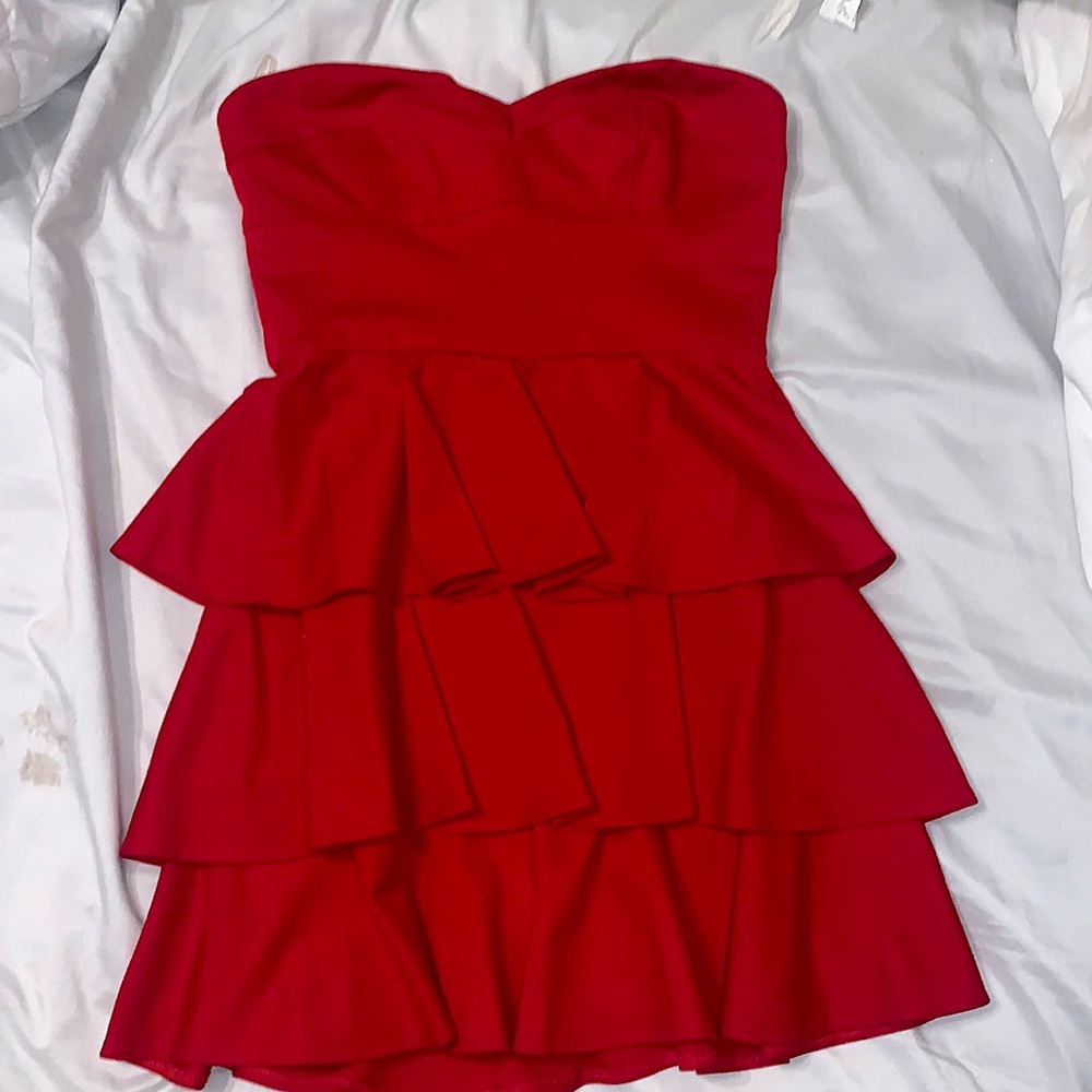 Red, strapless, and ruffled Amanda Uprichard mini dress. It still has the tag.